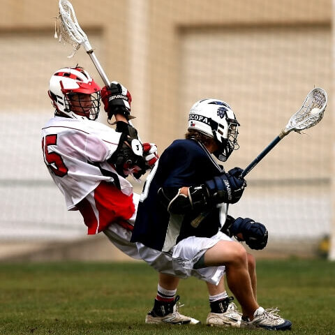 two guys playing lacrosse